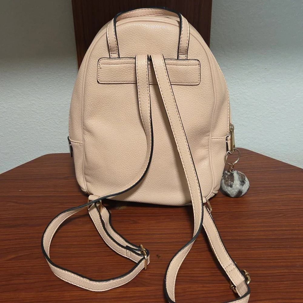 Elegant Light Pink Backpack with Gold Accents